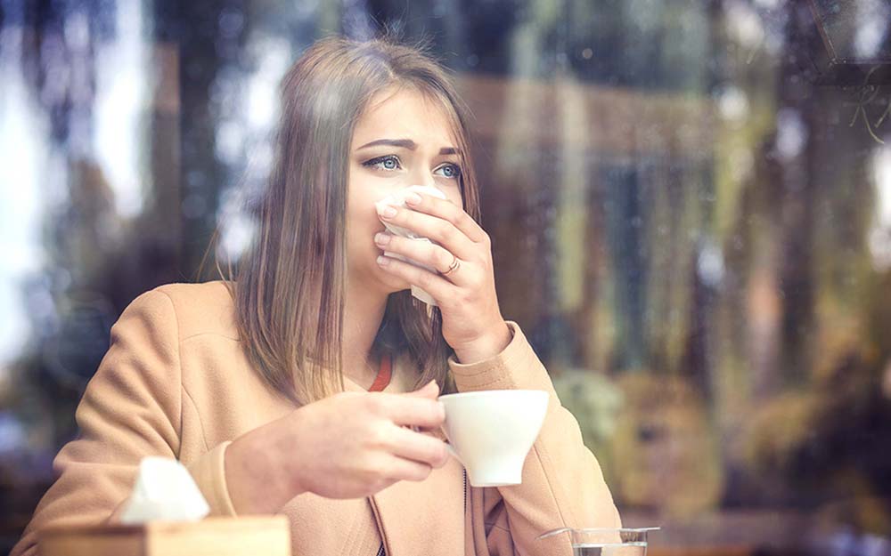 Image result for women try to prevent sneezing