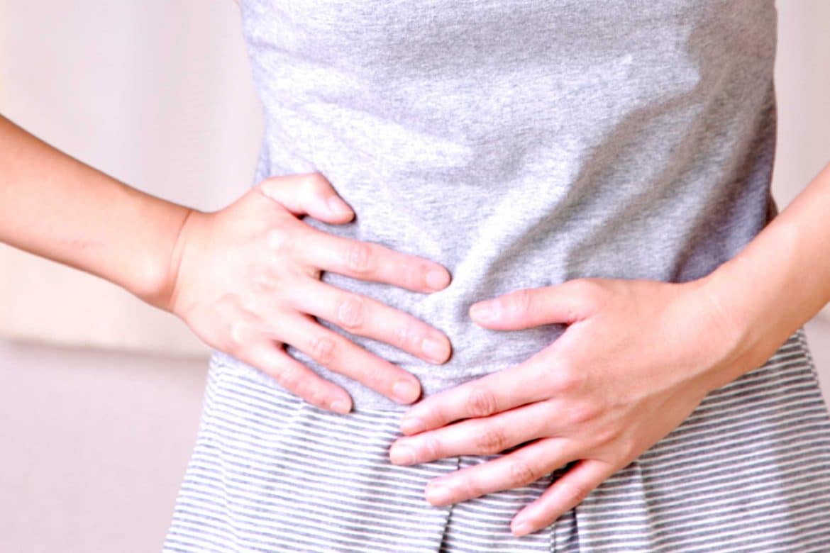 Image result for woman feel stomach hurt