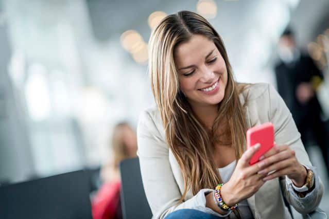 Image result for woman playing smartphone