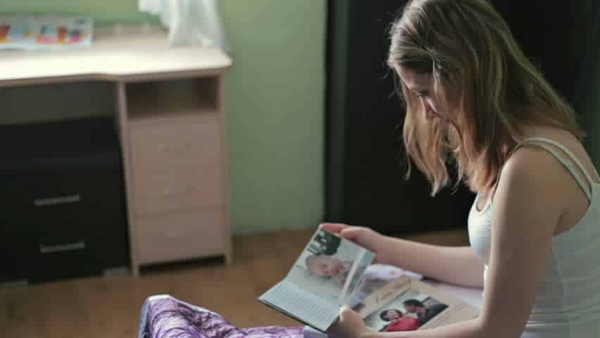 Image result for woman looking photo album