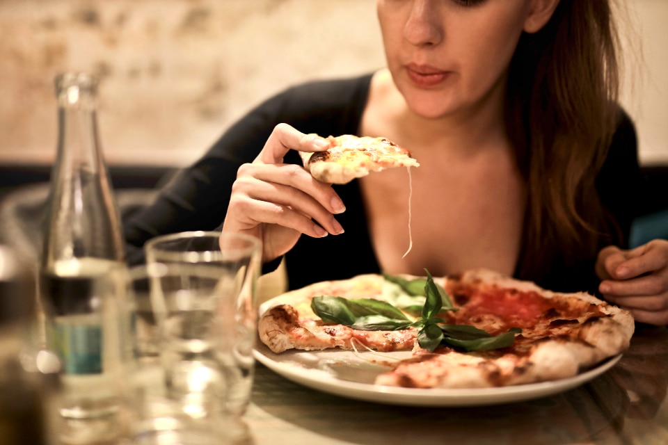 woman pizza food restuarant eat dinner drink girl italian knife meal plate tomato wine
