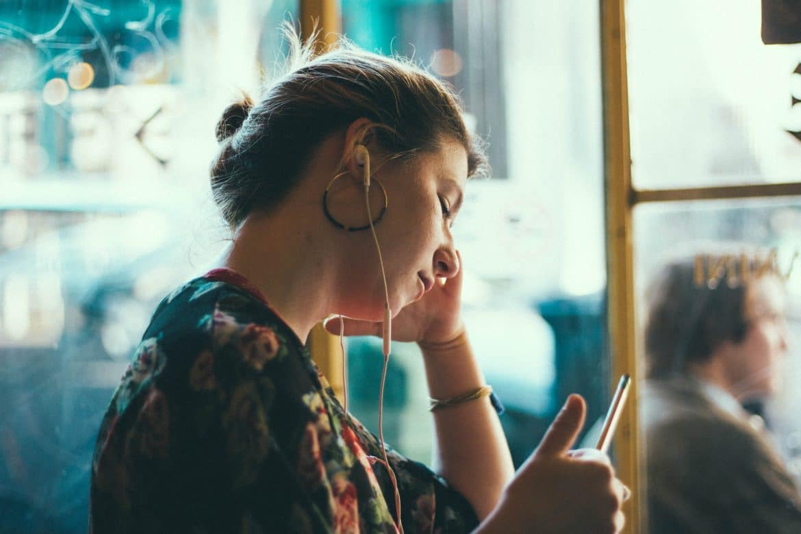 Image result for woman hear podcast on train